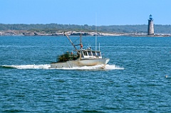 Old Lobsterboat Passes by Ram Island Ledge Lighthouse